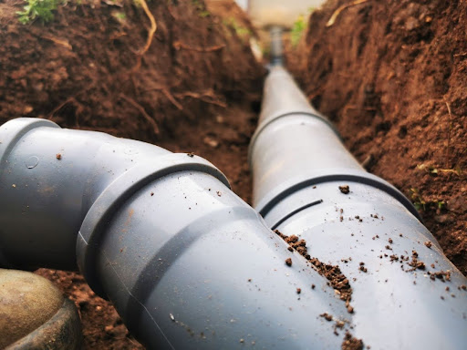 Plastic sawage pipes in the ground.