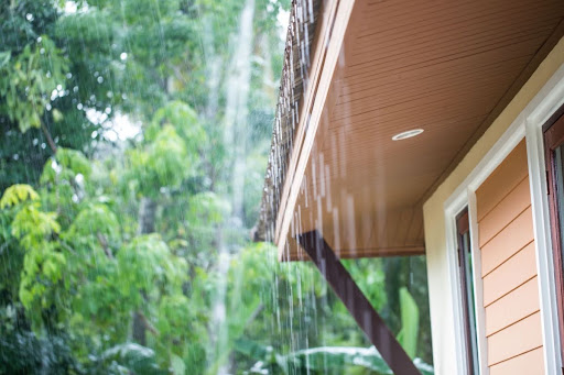 Rain hitting the roof of a house.